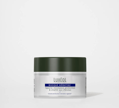Luxéol Kaukė su keratinu 200 ml indelis minimalistiniame fone giliam atkūrimui ir stiprinimui.