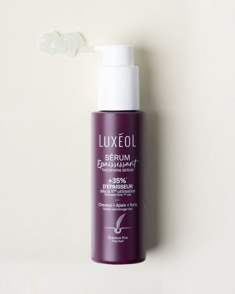 бутылка сыворотки для волос Luxéol на белом фоне